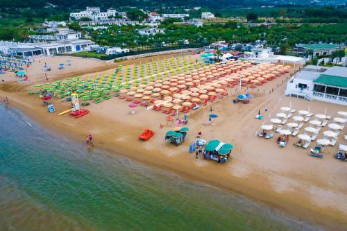 an aerial view of a beach with umbrellas and people at Park Hotel Valle Clavia in Peschici