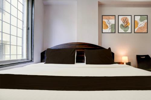 Postel nebo postele na pokoji v ubytování Super Hotel O Chhatrapati Nagar