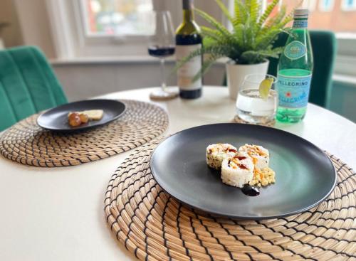two plates of food sitting on a table at Urban Heights - Professionals, Contractors, Long Stays, 2Bed, Sleeps 4, Central Location, in Bournemouth