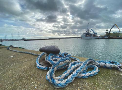a large blue rope on a dock with a boat at Urban Heights - Professionals, Contractors, Long Stays, 2Bed, Sleeps 4, Central Location, in Bournemouth
