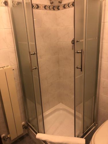 a shower with a glass door in a bathroom at Hotel Bucaneve in Pescasseroli