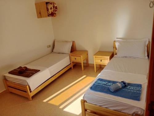 Postel nebo postele na pokoji v ubytování Ocean waves guest house
