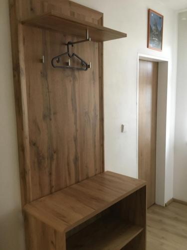 a wooden closet with a wooden door at Hrusická restaurace a penzion in Hrusice