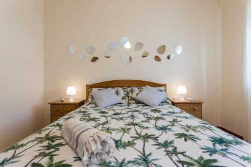 a bedroom with a bed and two night stands at Beachside Golf and City Escape by Lisbeyond in Tavira