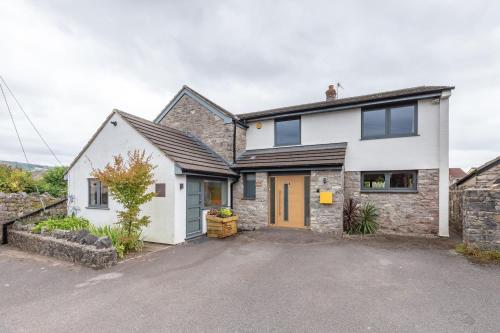 an image of a house with a driveway at Spacious House in the Heart of Cheddar in Cheddar