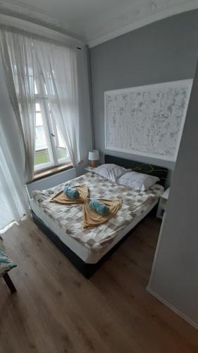 Cama o camas de una habitación en Central Sopot