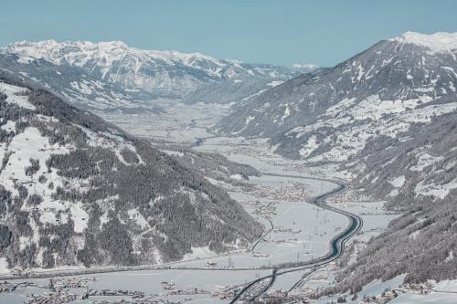 an aerial view of a river in the mountains at Huber's Lodge in Hainzenberg