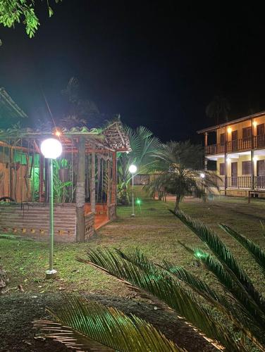 a street light in front of a building at night at Pousada Marcondes in Paraty