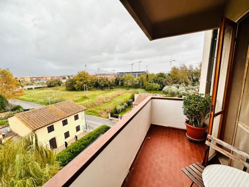 a balcony with a view of a street at Cisanello Guest House in Pisa