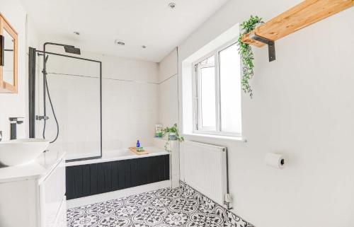 a bathroom with a shower and a sink at St Marys Hill Chapel in Tenby