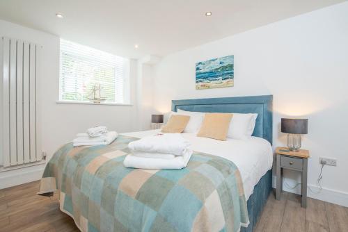 Ένα ή περισσότερα κρεβάτια σε δωμάτιο στο The Sail Loft