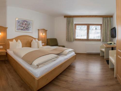 Ein Bett oder Betten in einem Zimmer der Unterkunft Frankenhof
