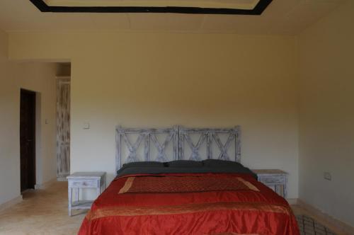 Postel nebo postele na pokoji v ubytování Kichaka Villa