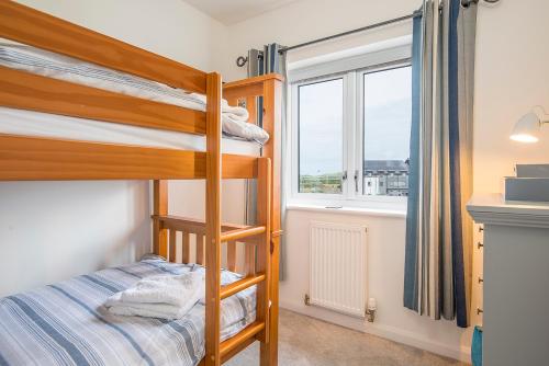 Ένα ή περισσότερα κρεβάτια σε δωμάτιο στο Ty Cuddfan