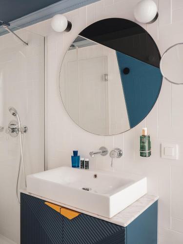 a bathroom with a sink and a mirror at Bob Hotel in Paris