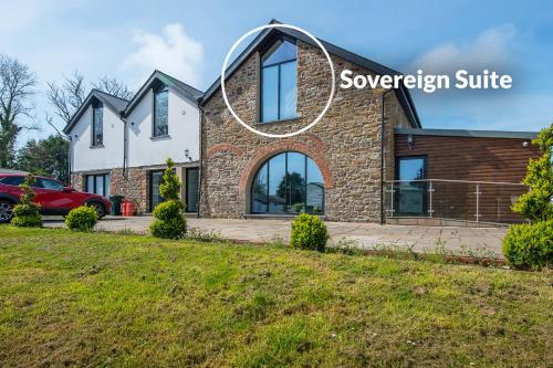 a house with a mirror on the front of it at Sovereign Suite in Saundersfoot