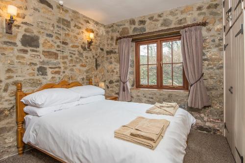 Postel nebo postele na pokoji v ubytování Heather Cottage