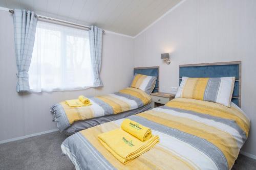 Postel nebo postele na pokoji v ubytování Valley Lodge