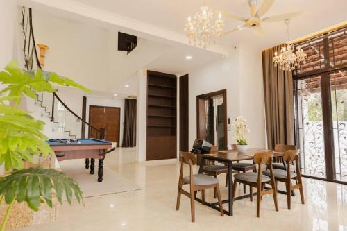 a living room with a pool table and chairs at Gelugor 2Storey Big Bungalow 23pax with BBQ Snooker in Gelugor