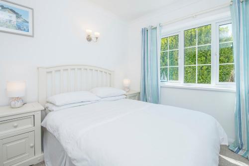 Postel nebo postele na pokoji v ubytování Pine Lodge