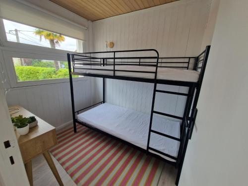 Ένα ή περισσότερα κρεβάτια σε δωμάτιο στο Maison au cœur de Tarbes