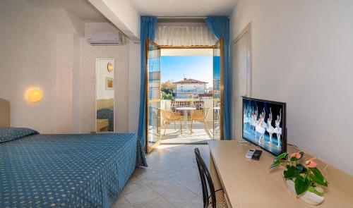 Postel nebo postele na pokoji v ubytování Hotel Mariotti