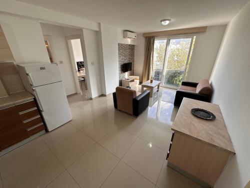 a kitchen and a living room with a refrigerator at Kyrenia center, 2 bedroom, 1 living room, residential apartment in Kérynia