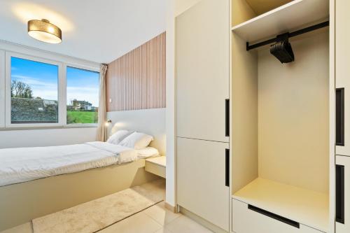 a bedroom with a bed and a window at Comfort & Style in Vibrant Luxembourg Coliving in Luxembourg