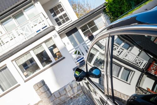 a car parked in front of a house at Spa Górka in Szklarska Poręba