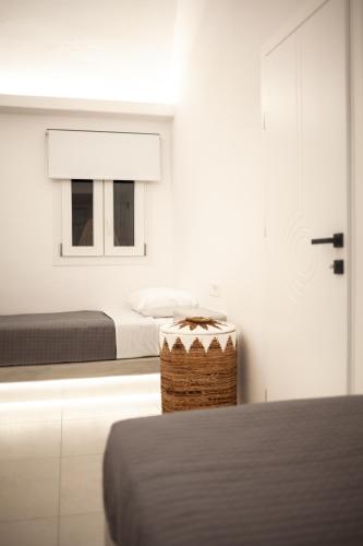 a bedroom with a bed and a window at Villa Izabela in Santorini