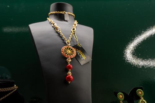 a necklace with a wheel on a chain at MAZZINI PALACE in Misterbianco