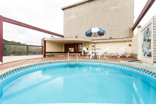 Bazén v ubytování Hotel Lopes Caxambu nebo v jeho okolí