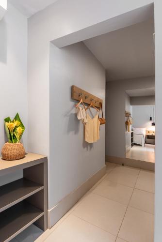 a walk in closet with white walls and a mirror at Pousada Corveta in Fernando de Noronha