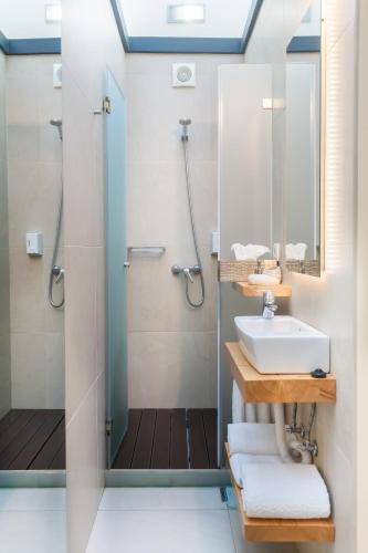 a bathroom with a sink and a shower at Sao Thiago House Madeira in Funchal