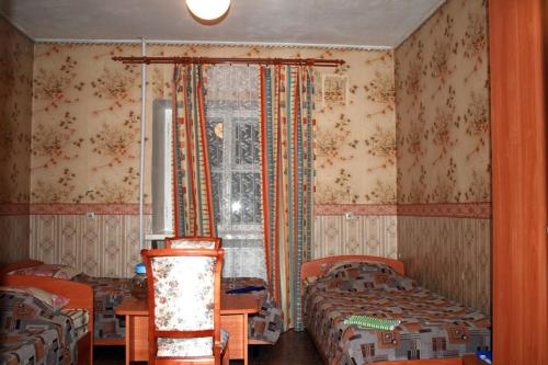 Un pat sau paturi într-o cameră la Lesogorskaya estate RUUSYAVI