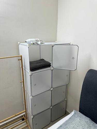 a stack of white drawers in a room at TuR05-Pisa Stadium-3room-Private in Bayan Lepas
