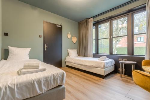 Ένα ή περισσότερα κρεβάτια σε δωμάτιο στο Hotel Zee Bergen