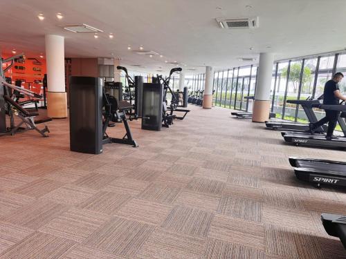 a gym with treadmills and exercise equipment in a building at TheBess Hotel Tokyo is located adjacent to Singapore and offers a sea viewIt is a family business smart room with the sea view of Princess Bay富力公主湾 in Johor Bahru