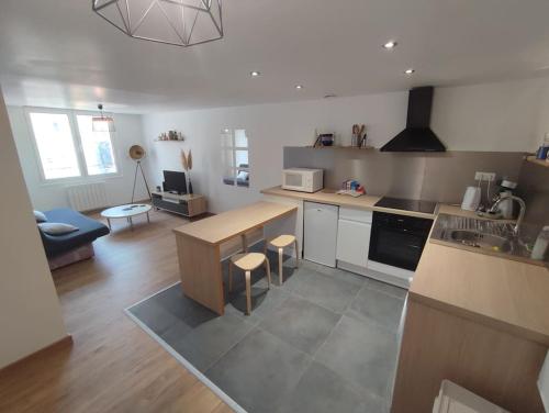 a kitchen with a sink and a counter top at Appartement T2 centre de Lourdes in Lourdes