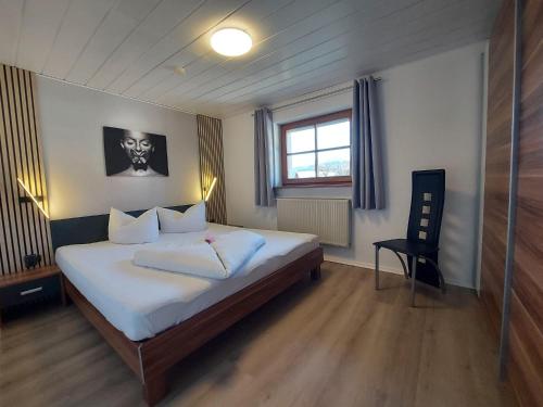 Postel nebo postele na pokoji v ubytování Ferienwohnung 19 Gipfelblick