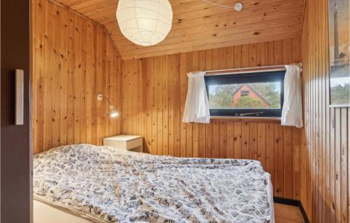 a bedroom with a bed and a window at 2 Bedroom Amazing Home In Skagen in Skagen