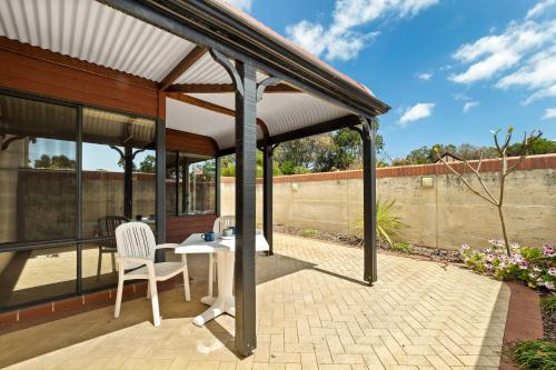 a pavilion with a table and chairs on a patio at Carinya Cove - swimming pool, pet friendly, fireplace in Dunsborough
