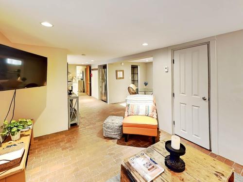 a living room with a bed and a table at Casa en Canyon in Santa Fe
