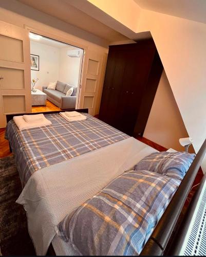 Postel nebo postele na pokoji v ubytování Dekster apartmani