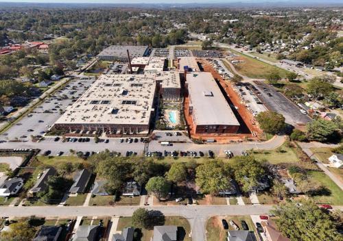 an aerial view of a large parking lot at Urban Escape Industrial 2BR 2BA in Greenville