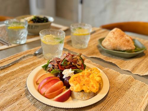 a table with a plate of food on a table at Yangshuo Hillside Homestay in Yangshuo