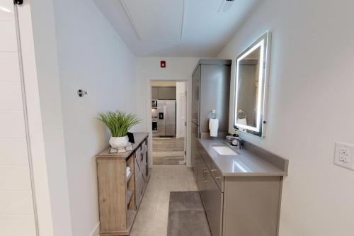 a bathroom with two sinks and a mirror at Great Location 1 Bedroom Sleeps 4 in Nashville
