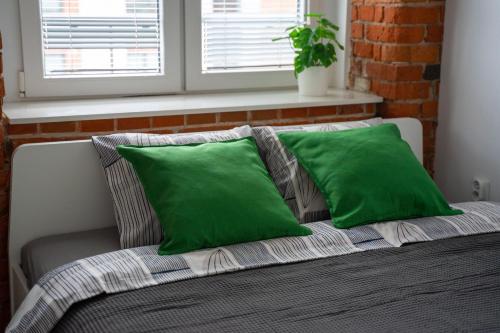 Posteľ alebo postele v izbe v ubytovaní Apartament z antresolą Nowa Papiernia