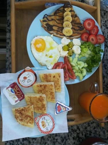 a plate of breakfast food with eggs and toast at RIAD AMR in Tangier