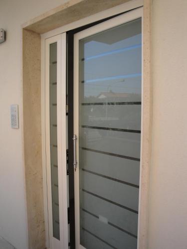 a door to a room with a view of the ocean at Residence La Nave in Senigallia